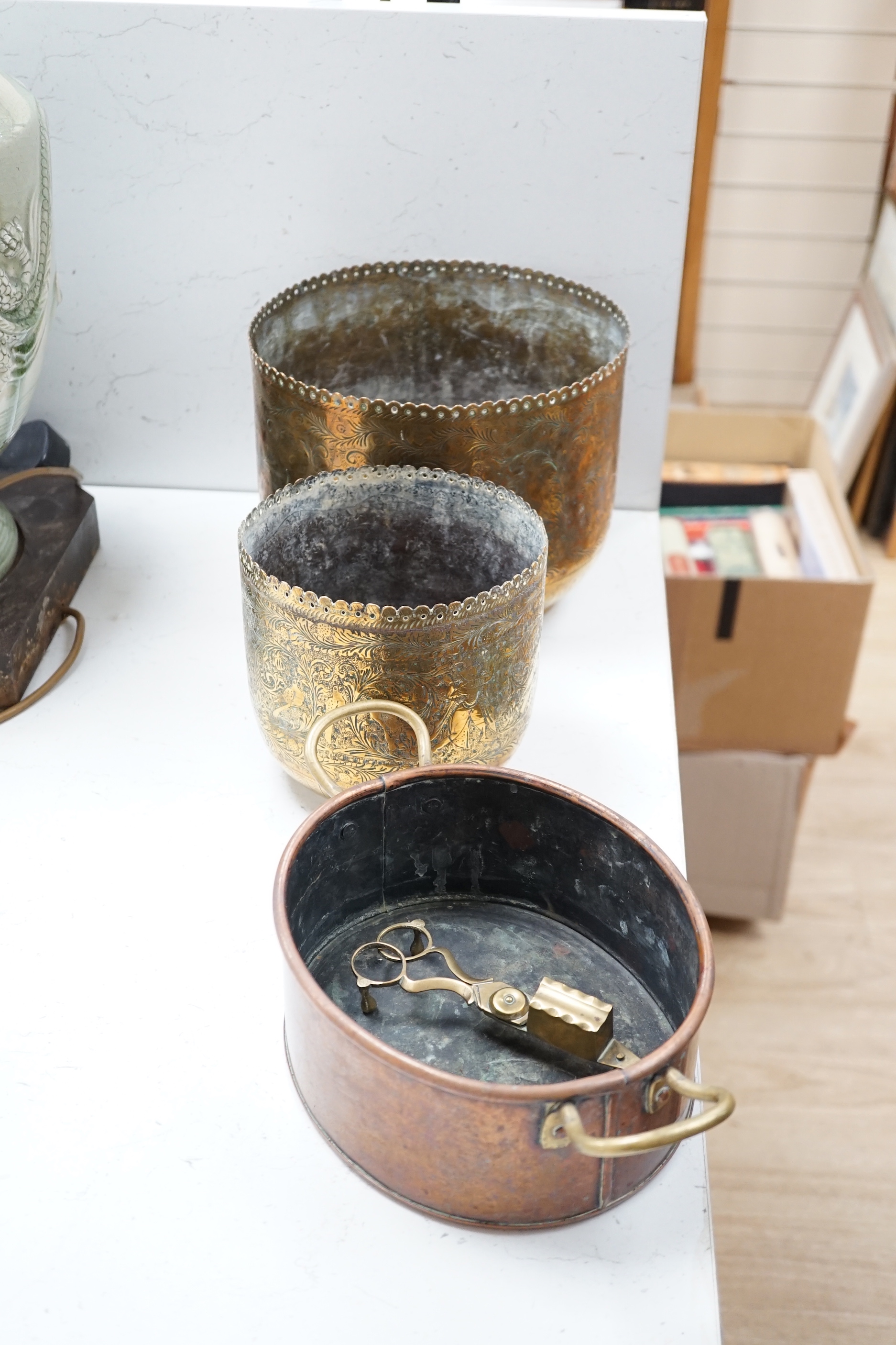 Two brass planters and a trivet, a copper pan, a Doulton vase, two teapots, a candle wick trimmer and a Chinese vase stand, tallest 34cm